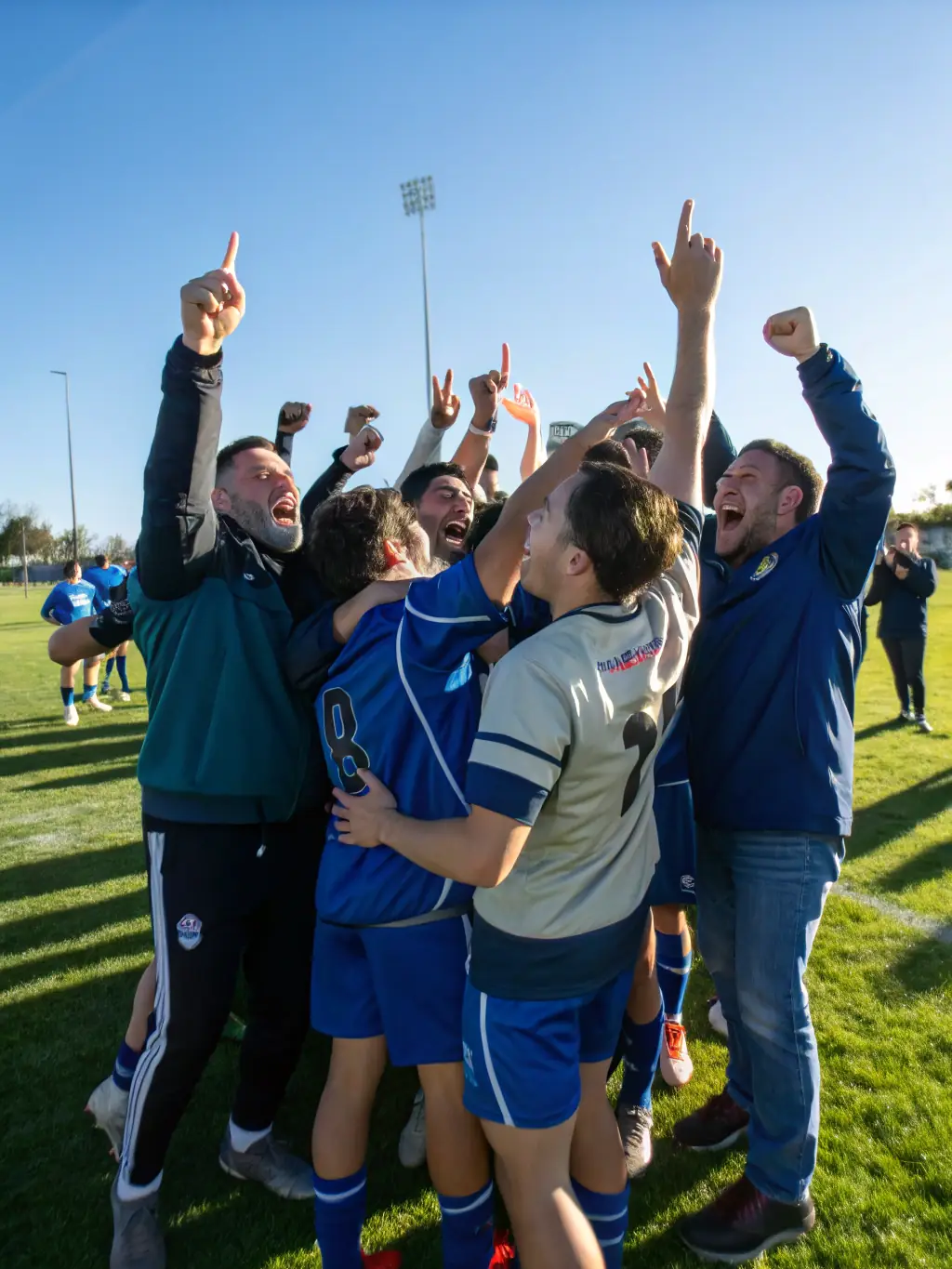 Students from ASSOCIATION SPORTIVE DU COLLEGE D'YDES are celebrating a victory, showcasing the joy of sports and the sense of community.